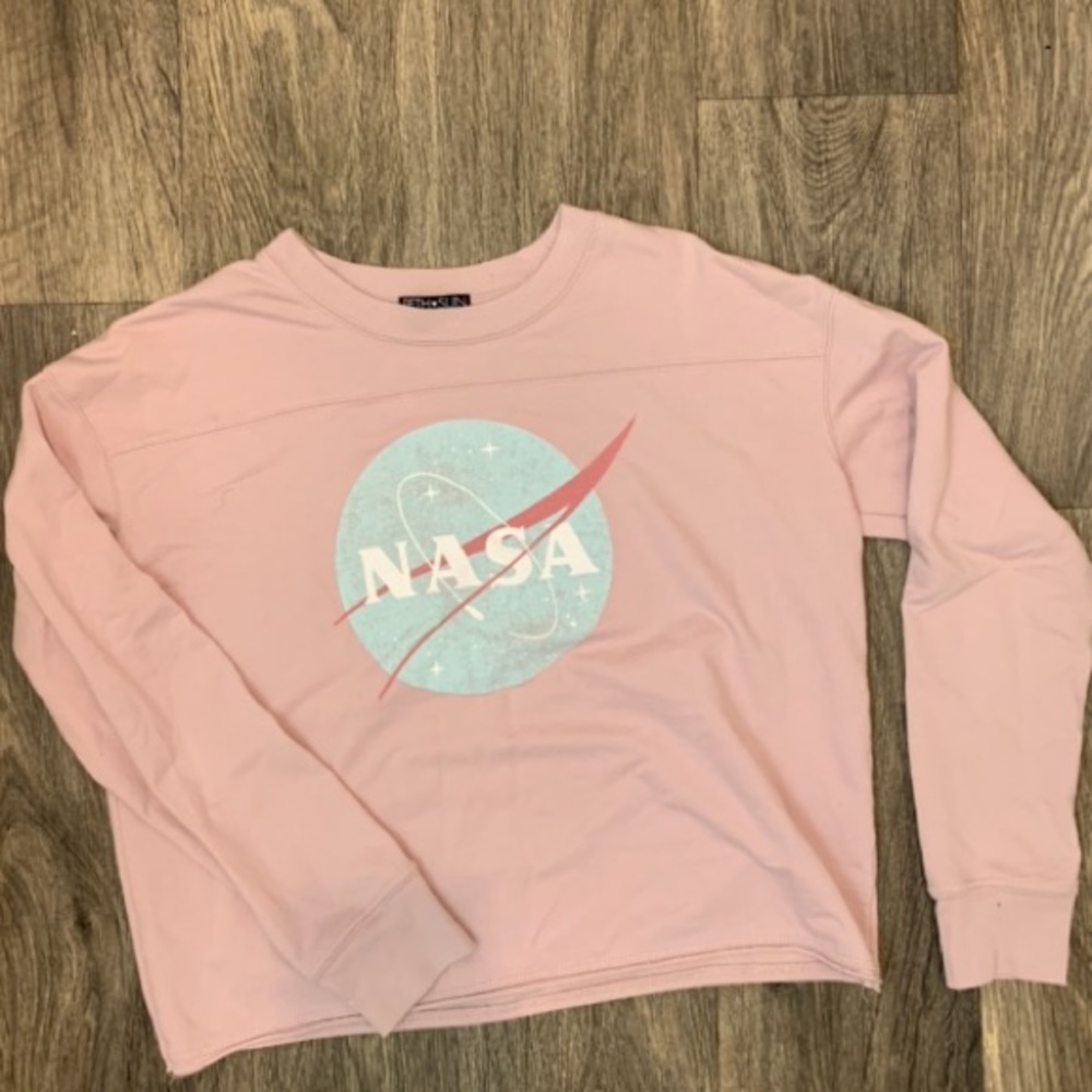 Dusty pink NASA shirt.
